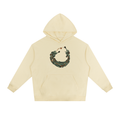 Heavyweight drop-shoulder hoodie in light apricot, front graphic and kangaroo pocket.
